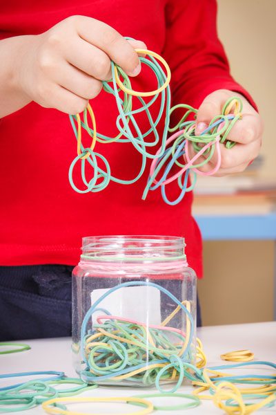 Preschooler Playing with Rubber Erasers - Family Life Tips Magazine